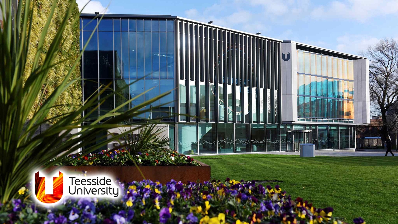 Teesside Univeristy building with a lawn and flowers